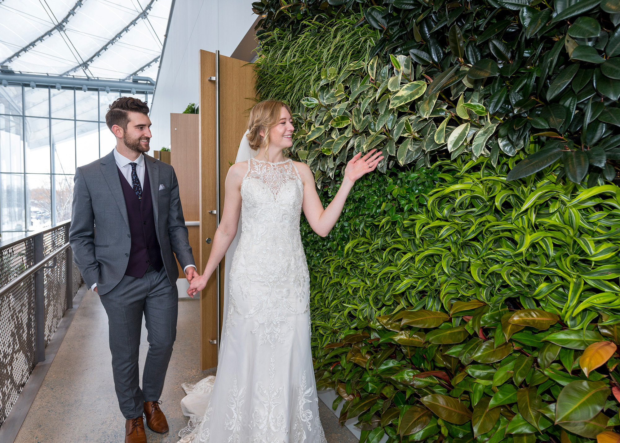 bride and groom at the Green Wall at The Leaf Banquet Hall 